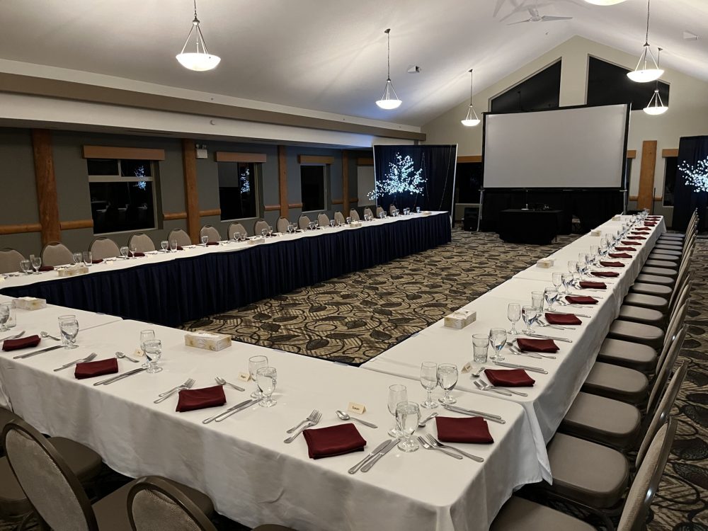 U-shaped conference table setup with presentation screens at Best Western Plus Valemount