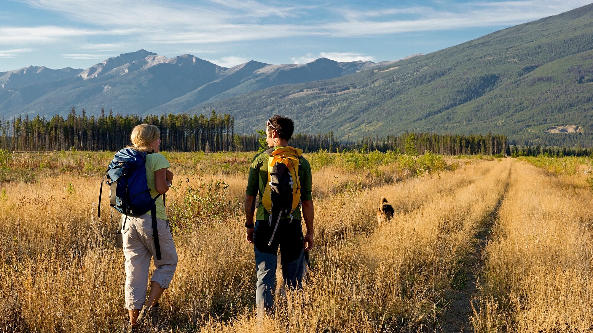 Two guests hiking on a trail with mountain views near Best Western Plus Valemount
