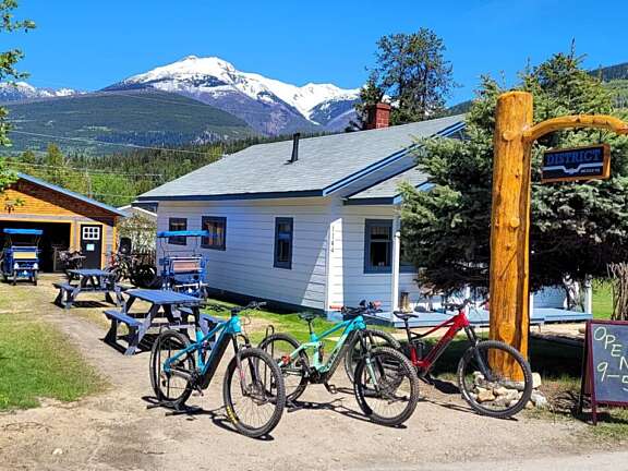 Mountain bikes outside District Bike Company in Valemount on a sunny day